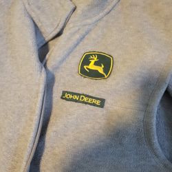 John Deere vest and long sleeve T-shirt.