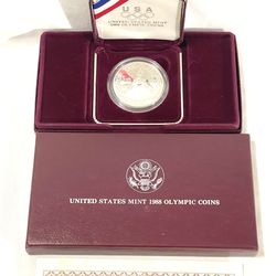 Mint condition sealed in capsule with case and certificate 1988 (Olympic liberty) silver dollar proof