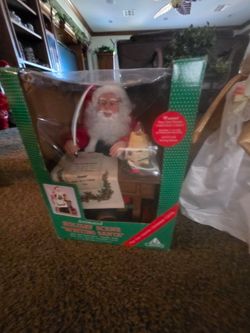 Christmas animated Santa Claus, plug him in and he moves like he's writing on the disk and plays music $80. The animated deer is from christmas. Plug