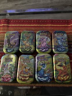 Pokemon Prismatic Evolutions Tins