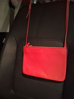 Celine Trio Crossbody Bag in a vibrant red.