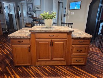 Tiered kitchen island with 3 power outlets