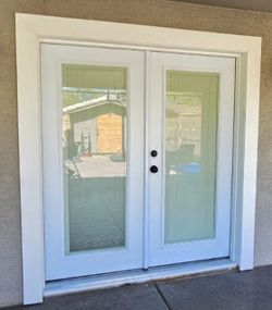 Brand new french doors with the built-in blinds