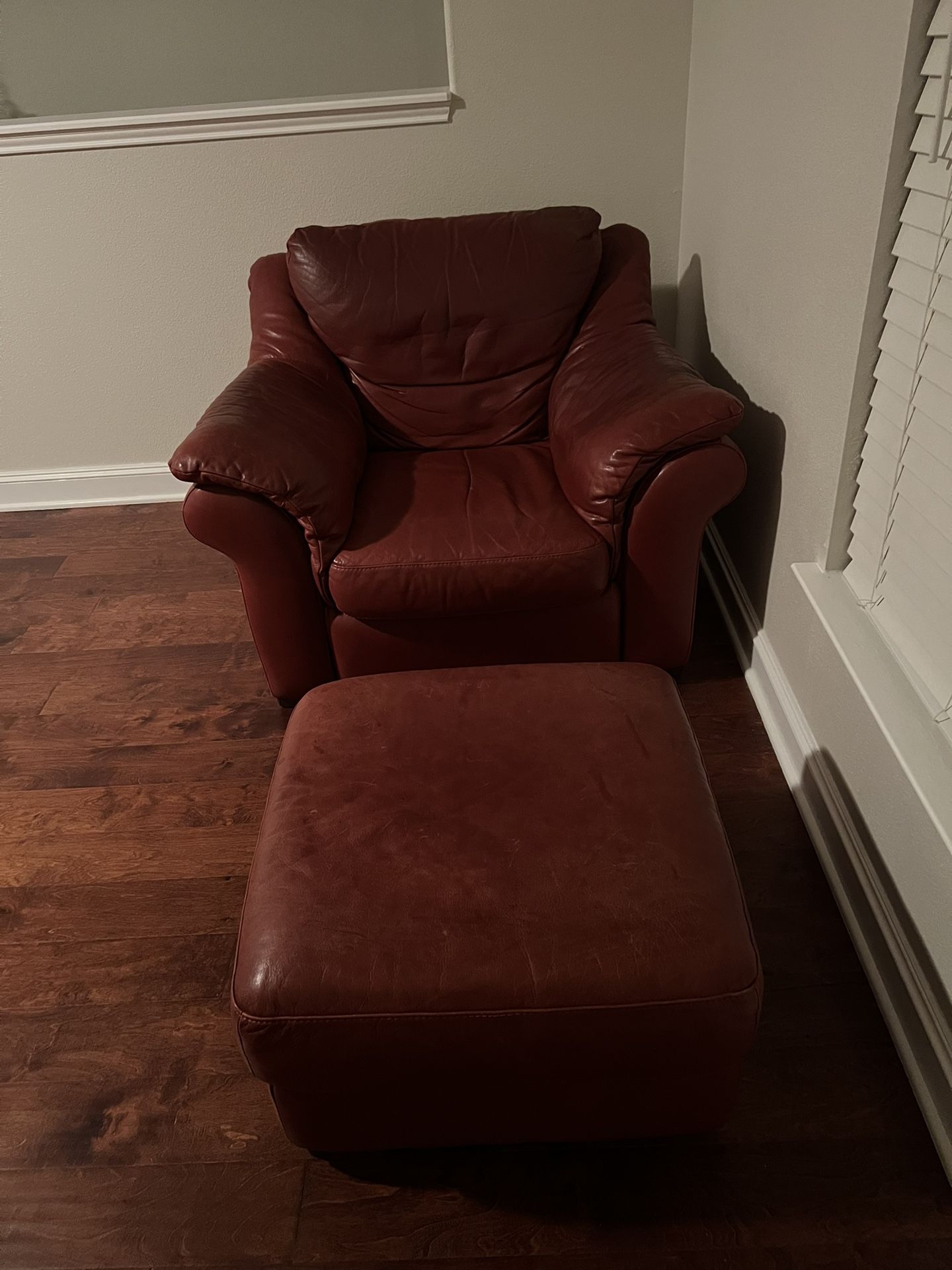 Red leather chair and ottoman