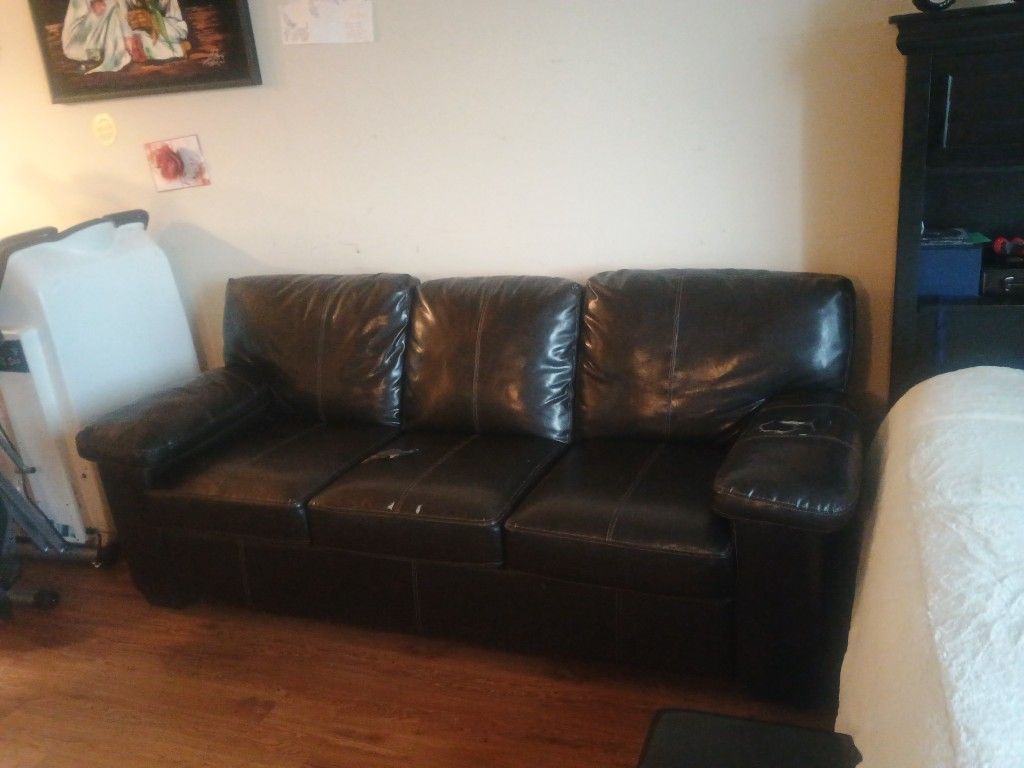 Dark Brown Leather Couch Has A Tear On One Cushion And The Left Arm Can We Fixed Good Couch Good Condition