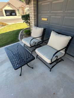 Patio set. Deep seat rocking chairs. New cushions. All metal. Very nice.