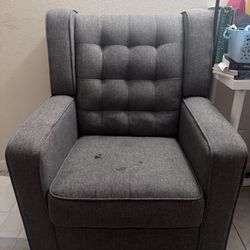 Grey tufted rocking chair
