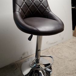 2 Chrome And Brown Adjustable Bar Stools $100