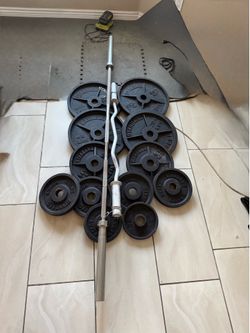 Olympic weights 370lbs total plus 7ft 40lbs bar and curl bar