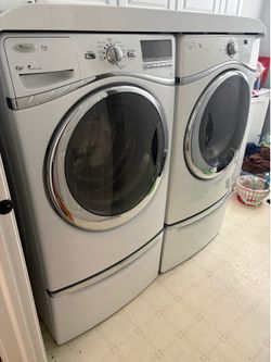 Whirlpool washer and dryer combo with underneath storage and top shelf