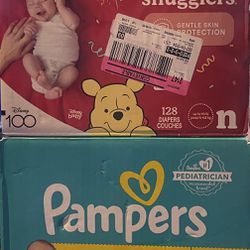 two Boxes Of Newborn Diapers 