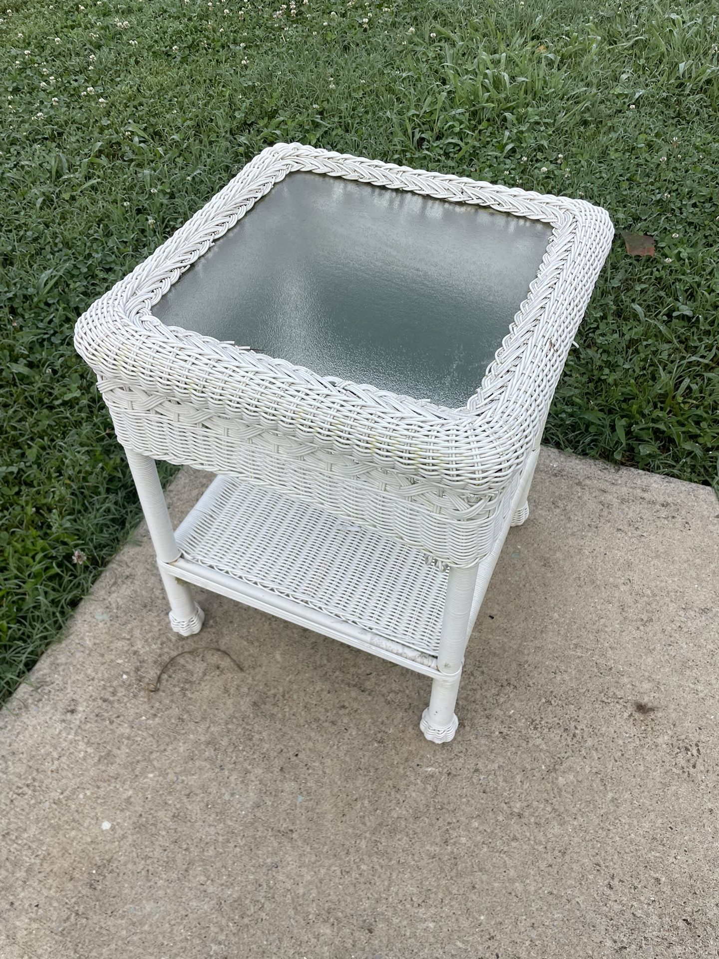 White wicker side table with glass