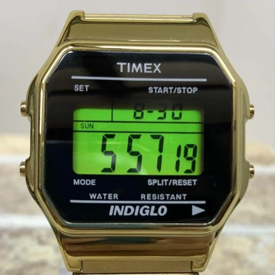 Timex Classic Digital watch in a gold tone with an expansion band and Indiglo backlight.