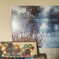 Set of two paintings: abstract circles and landscape scene.