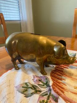 Vintage heavy brass pig bank. 5 inch tall x 10 long. Missing tail & stopper. Farmhouse/ cottage.