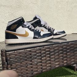 White, Black, And Gold Jordans