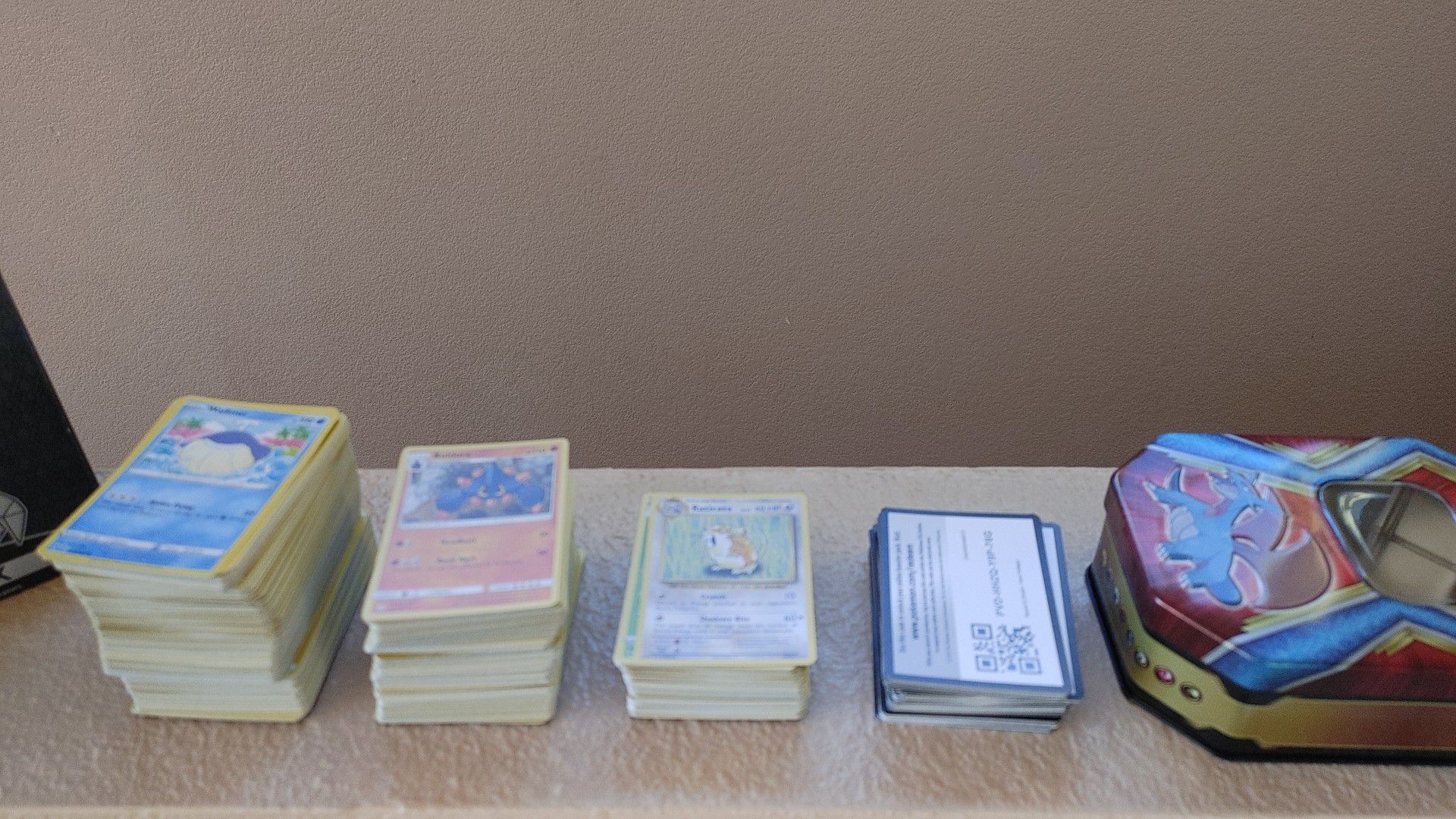 Pokemon Cards, empty tin and elite trainer box opened.