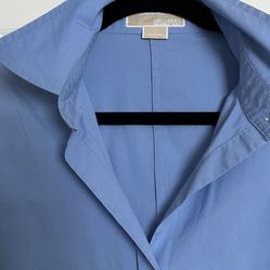 It’s A Beautiful Woman’s Shirt In Size 12 The Color Is baby blue made by Michael Kors