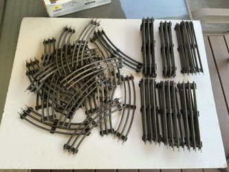 Vintage (56) LIONEL train tracks O/27 gauge tubular 9'”. 31straight, 25 curved.