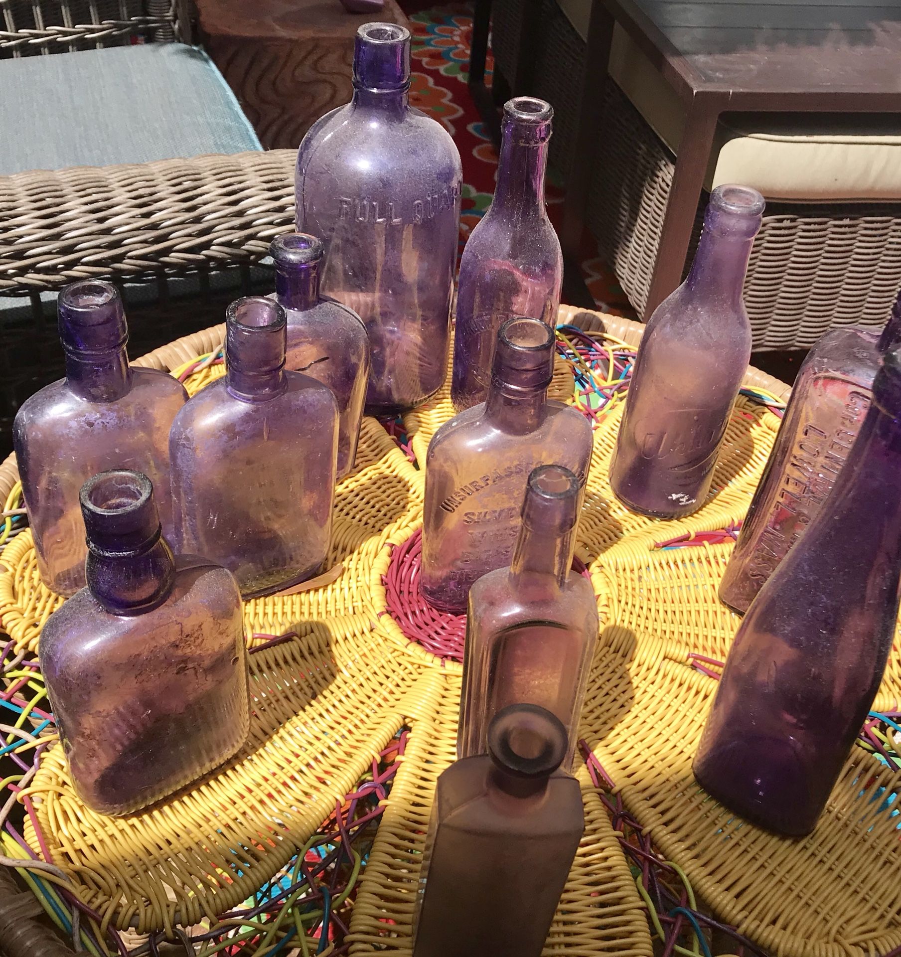 Collection of antique purple glass bottles