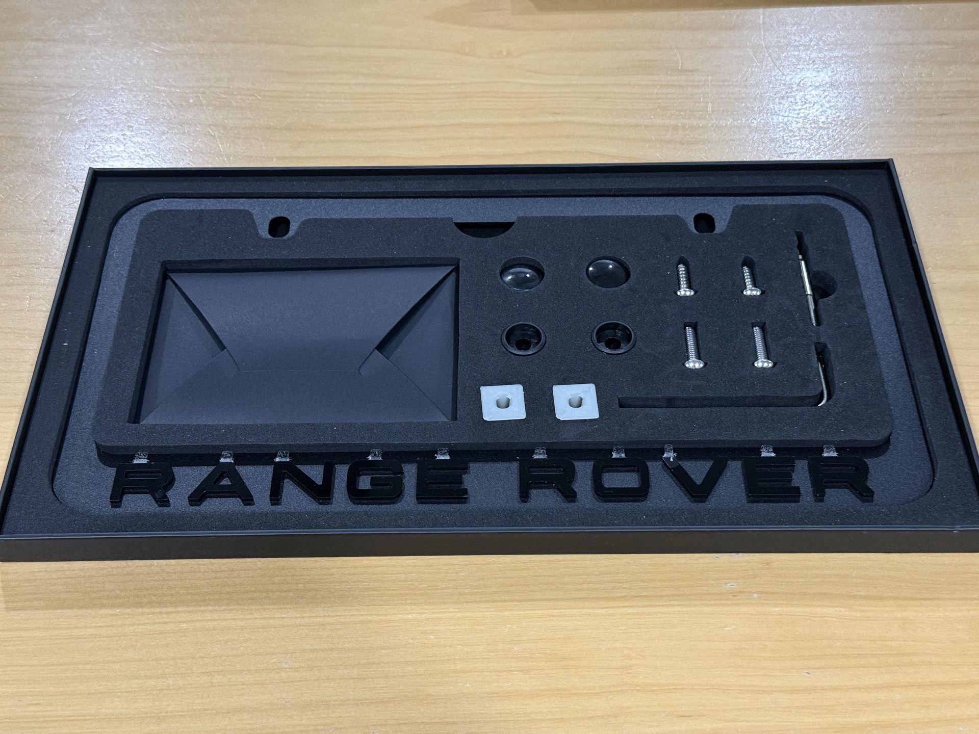 New ( Open Box) RR Black License Plate Frame with accessories.