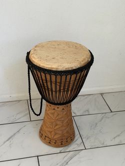 Handa-Carved Wood Djembe Drum  Condition used like new  Length size:24 inches  Size above 12 inches