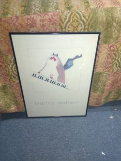 This is a Vintage framed art print featuring a cat playing the piano, by the artist Martha Wahlert. 
Signed By Artist
