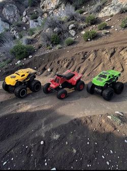 (Lot Of 3) Assorted Monster Trucks/"96 Racing"/"Torque"/ "Venom" Quad Bike/ Toys.  Based on a visual inspection, the toy vehicles appear to be in exce