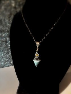 Black gold necklace with turquoise and yellow Swarovski pendant