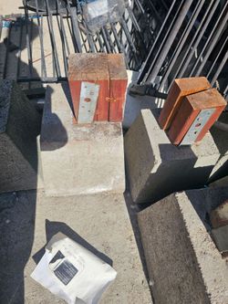 Precast concrete pier with metal post bracket.