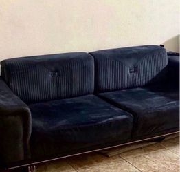 A sofa that opens and folds into a queen bed..