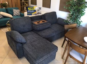 Convertible sectional sofa with pull-out bed & reversible chaise