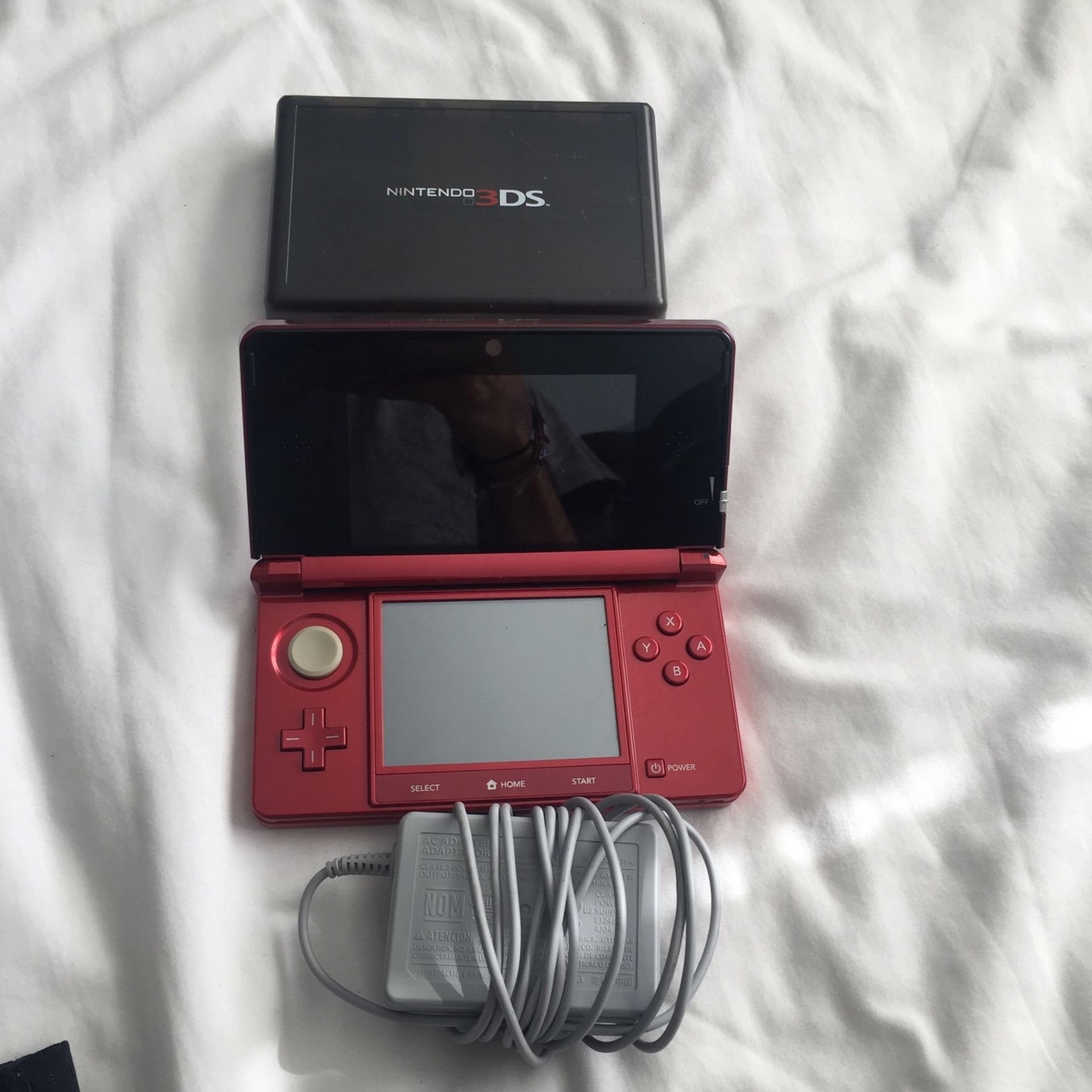 Nintedo 3DS (red model) comes with Charger and 18 playable games