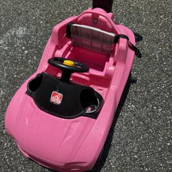Pink step to ride on car