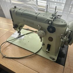 Sewing Machine With Discs And Manual