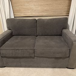 62 Inch Gray Radley Loveseat (Macy’s)