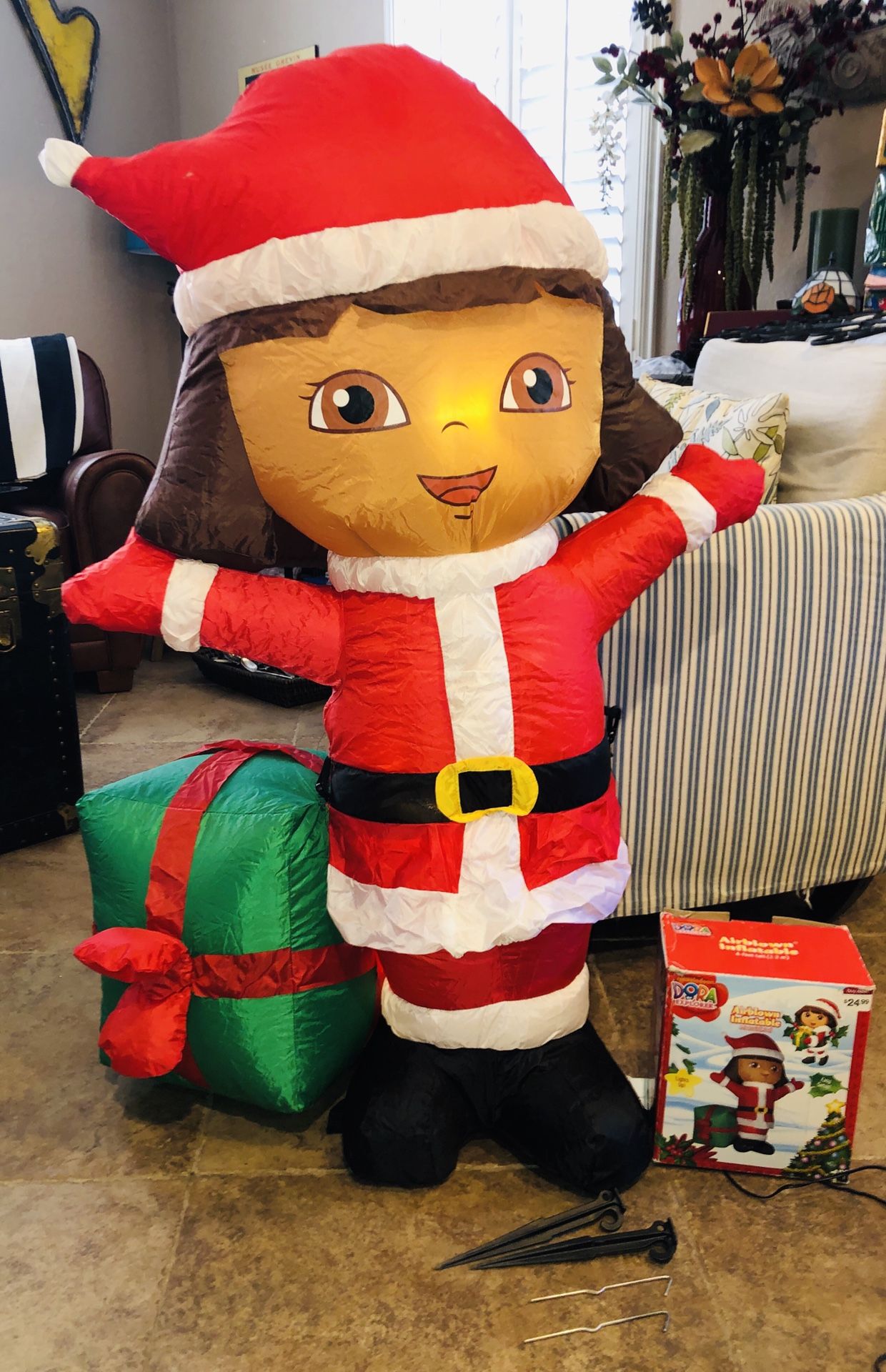 Dora the Explorer 4 ft Airblown Inflatable Christmas Holiday Yard Decor! Dora in a Santa Suit with nicely wrapped gist present with red bow.