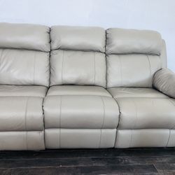 Matching gray top grain leather reclining sofa and recliner set