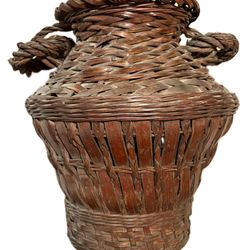 Antique woven bamboo ikebana basket with handles