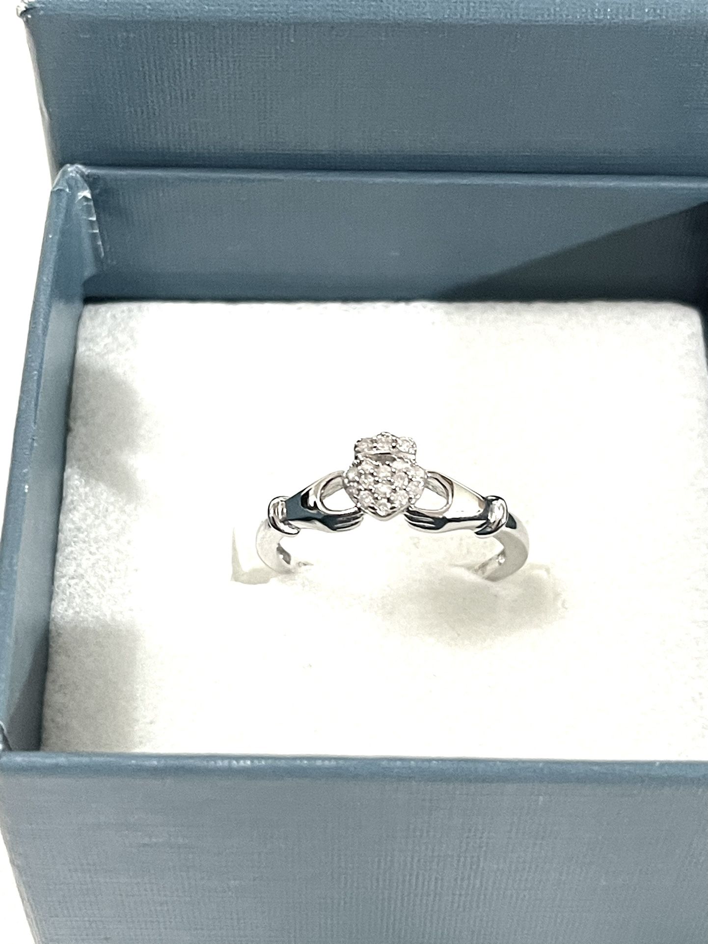 Brand New 16 Authentic Diamonds Set In A Sterling Silver Wedding Ring. Size 7. I will bring the diamond tester.