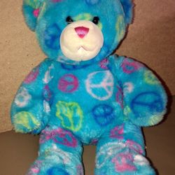 Build a bear, blue bear with peace ☮️ symbols. Approx 15 inches. In good condition. Makes a great gift 🎁