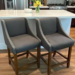 Gorgeous bar upholstered counter stools with nailhead trim and armrests