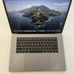 Apple MacBook Pro 15 inch w/ Touch Bar – Fully Loaded Software – Excellent Condition