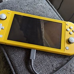 Nintendo Switch Lite Yellow With Two Cases