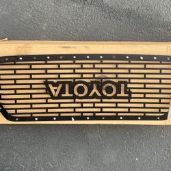 metal “heritage/retro TOYOTA” style grille insert for a 2016–2019 Toyota Tacoma