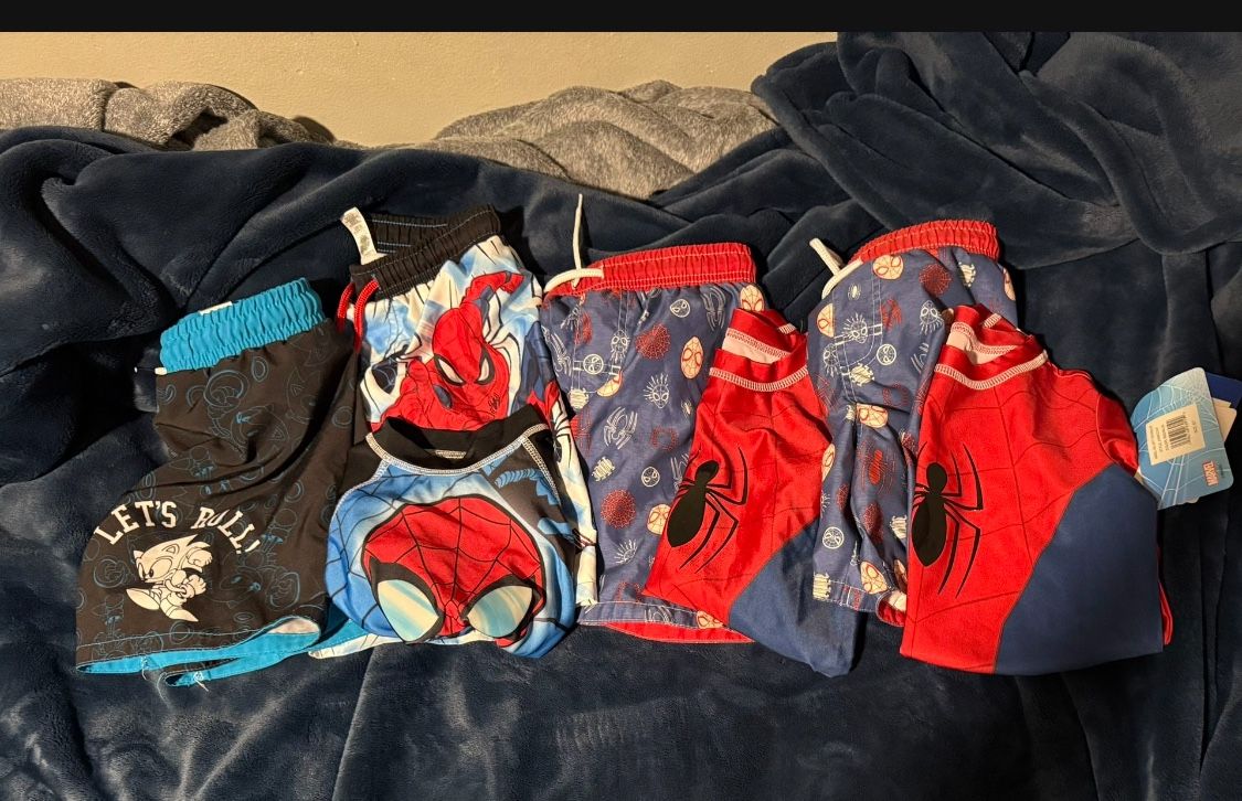 Used Boys swim shorts with new splash guard shirts Size 6/7