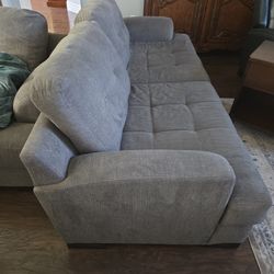 Two Identical Sofas In Good Condition 