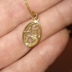 Gold Necklace And Charm