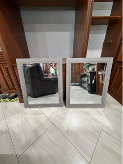 2 light gray mirrors