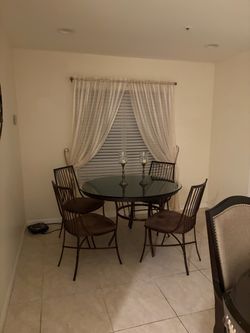 Iron dining table glass top